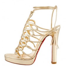 Sandali Christian Louboutin con nappine da 120 mm, colore oro.